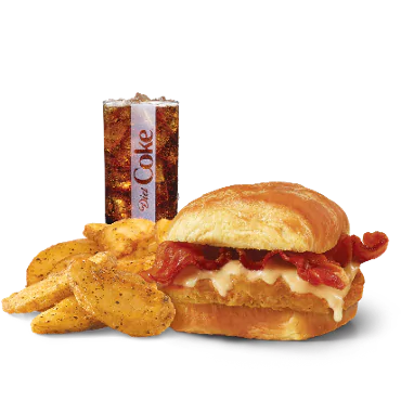 “Wendy’s Maple Bacon Croissant Combo with crispy bacon on a flaky croissant, served with seasoned potatoes and a drink.”