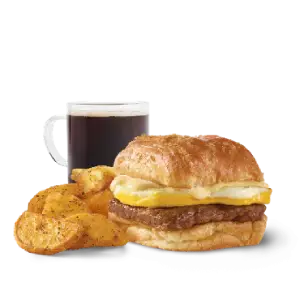 “Wendy’s Bacon Croissant Combo with crispy bacon on a flaky croissant served with seasoned potatoes and a morning drink.”