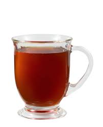 A steaming cup of hot tea served in a mug, offering a soothing and aromatic flavor.