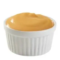 Warm cheddar cheese sauce with a rich, creamy texture, perfect for dipping.