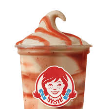 A Wendy’s Chocolate-Covered Strawberry Frosty topped with rich chocolate sauce and fruity strawberry flavor.