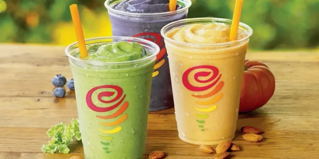 Bright Jamba Juice smoothies in colorful branded cups on display