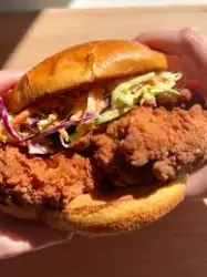 Crispy breaded spicy chicken fillet inside Wendy’s toasted sandwich bun