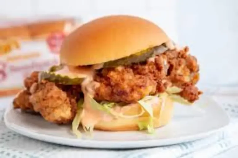 Close-up of Wendy’s Classic Chicken Sandwich showing golden breaded chicken and fresh toppings