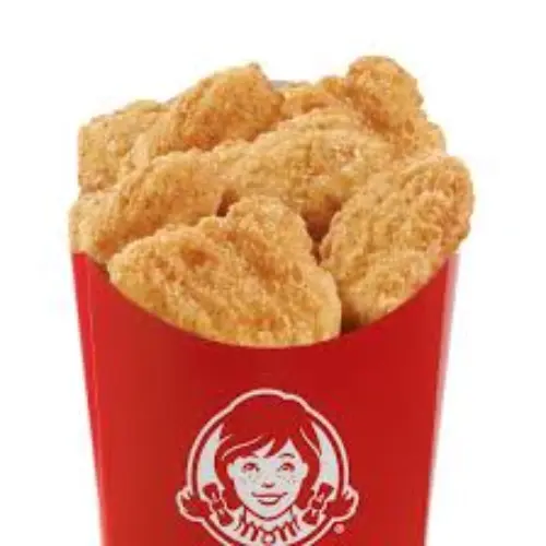 Wendy’s 10 P.C. Saucy Nuggets coated in spicy sauce, crispy and golden on a tray